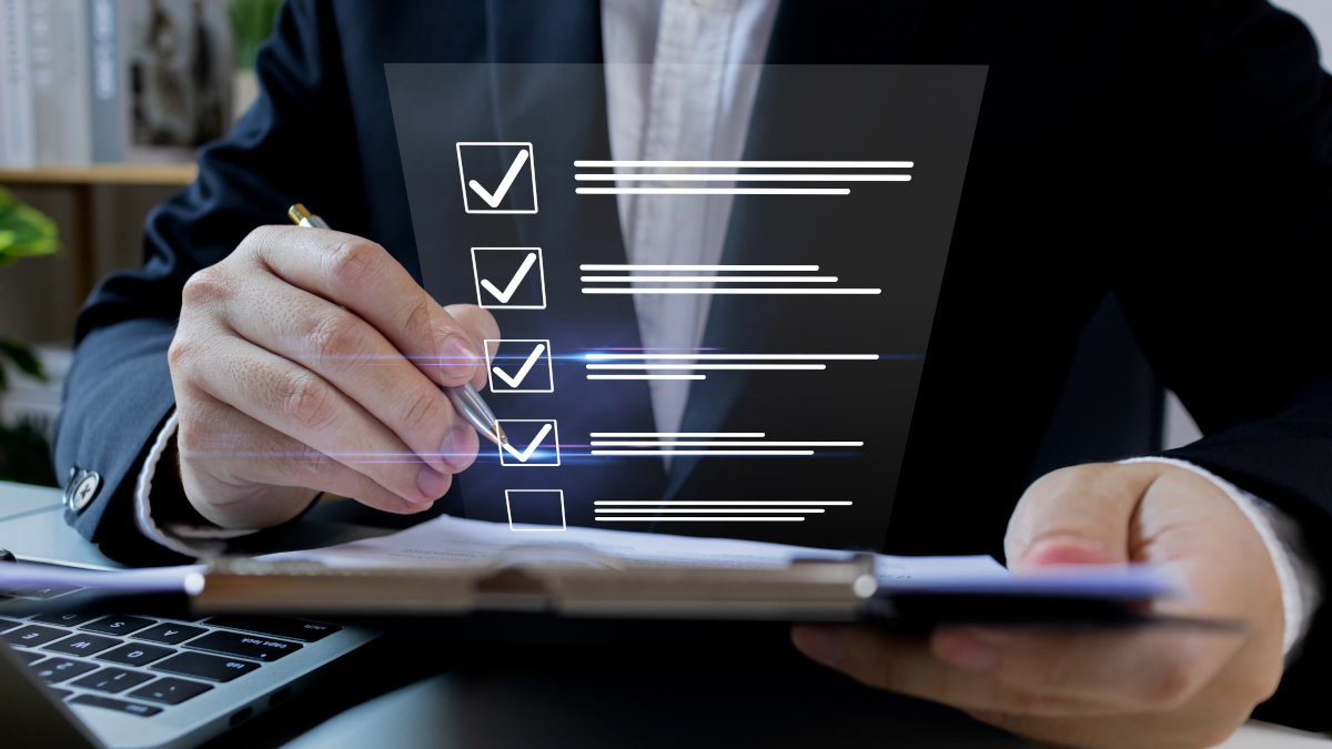 man holding clipboard with images checkboxes overlaid