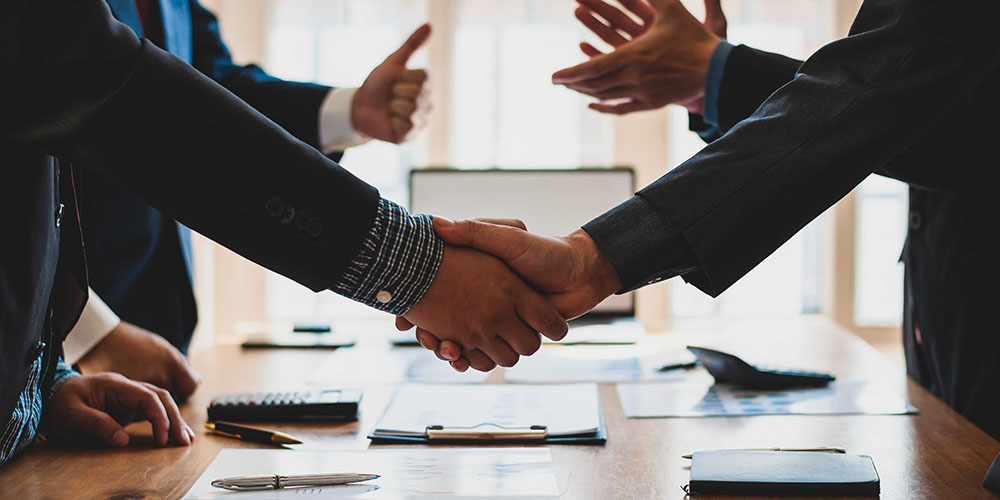 People shaking hands in an office