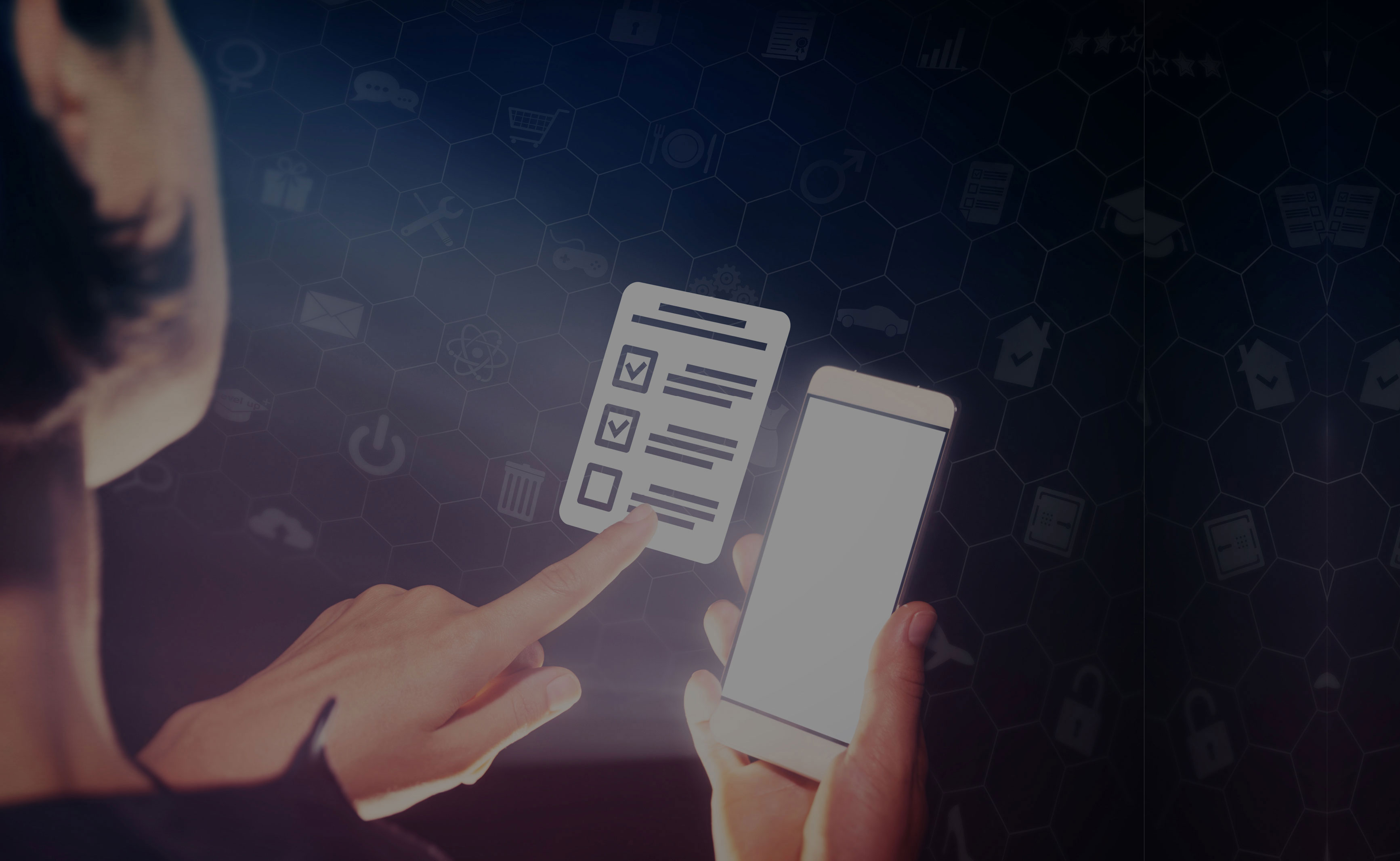 dark over-shoulder view of woman using glowing smartphone to tap simplified tick boxes